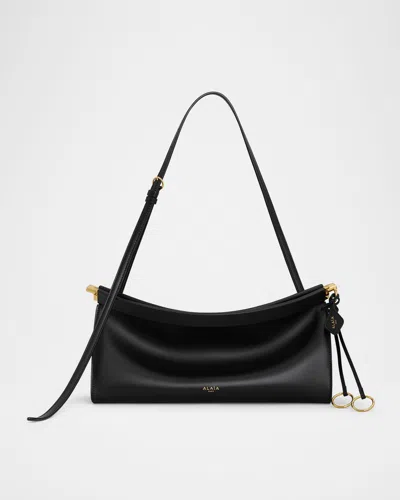 ALAÏA LE CLICK SMALL SHOULDER BAG IN GLOSSY LEATHER