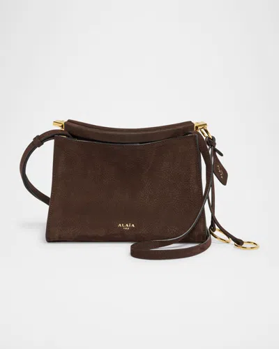 ALAÏA LE CLICK SMALL SHOULDER BAG IN NUBUCK LEATHER