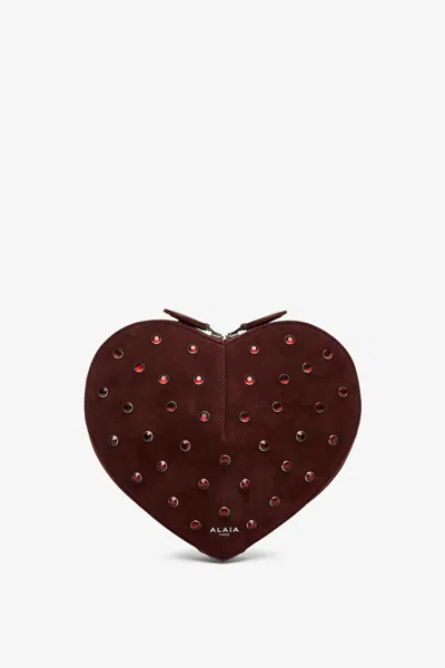 Alaïa Le Coeur Riveted Strass Suede Crossbody Bag In Rouge Grenat