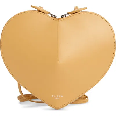 Alaïa Le Coeur Leather Crossbody Bag In Gold