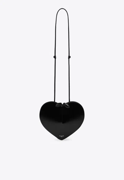 Alaïa Le Coeur Patent Leather Crossbody Bag In Black