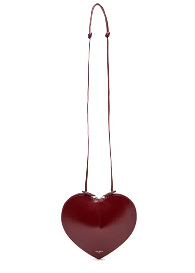 Alaïa Le Couer Glossed Leather Cross-body Bag In Burgundy