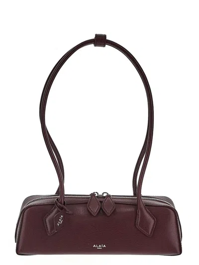 Alaïa Le Teckel Bag In Red
