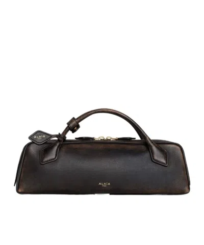 Alaïa Le Teckel Clutch In Aged Leather In Black