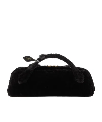 Alaïa Le Teckel Leather-trimmed Shearling Clutch In Black
