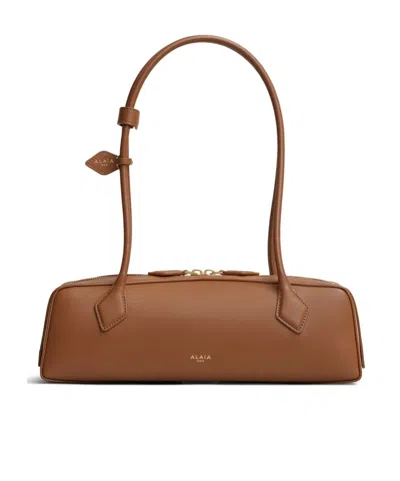 Alaïa Le Teckel Medium Bag In Calfskin In Amber