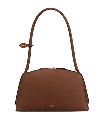 Alaïa Leather Le Bouledogue Shoulder Bag In Brown