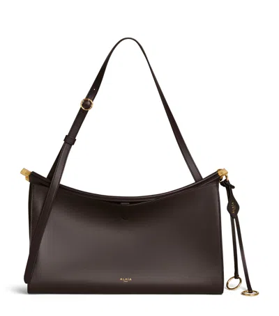 Alaïa Leather Le Click Pocket 35 Shoulder Bag In Brown