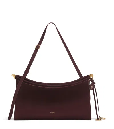 Alaïa Leather Le Click Pocket 35 Shoulder Bag In Brown