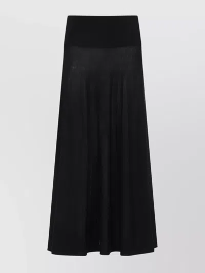 ALAÏA LONG FLARED WOOL SKIRT WITH SHEER FABRIC