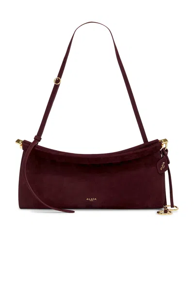 Alaïa Medium East West Bag In Burgundy