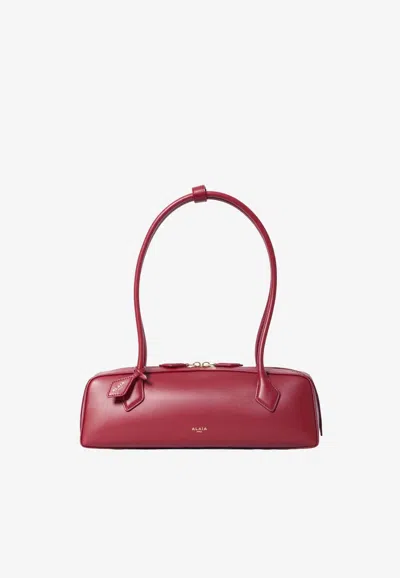 Alaïa Medium Le Teckel Elongated Shoulder Bag In Red