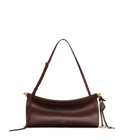 Alaïa Medium Leather Le Click East West Shoulder Bag In Brown