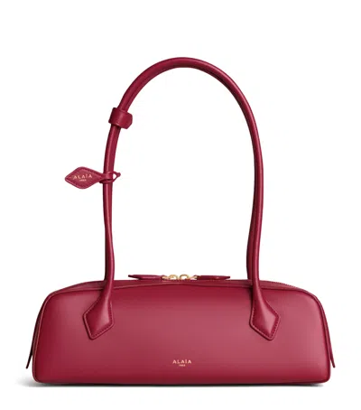 Alaïa Medium Leather Le Teckel Shoulder Bag In Pink