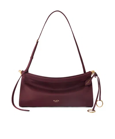 Alaïa Medium Logo Shoulder Bag In Burgundy