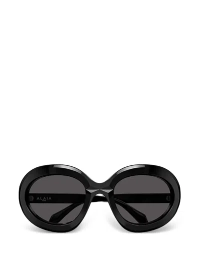 Alaïa Oval Frame Sunglasses In Black