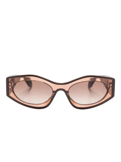 Alaïa Oval-frame Sunglasses In Brown