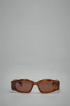 Alaïa Logo Sunglasses In Brown