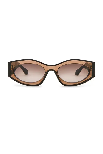 Alaïa Oval Sunglasses In Brown