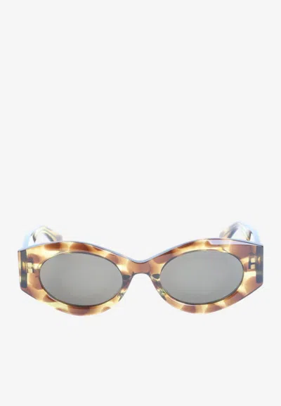 Alaïa Oval-frame Logo Sunglasses In Gray