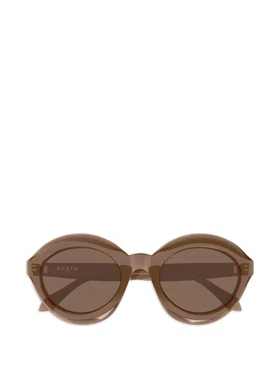 Alaïa Oval-frame Sunglasses In Brown