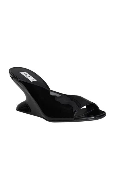 ALAÏA PATENT LEATHER WEDGE MULES