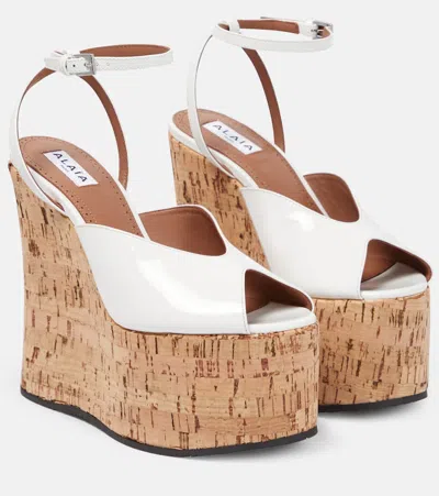 Alaïa Patent Leather Wedge Sandals In White