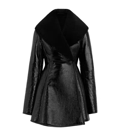 Alaïa Shearling-trimmed Leather Coat In Black