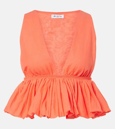 Alaïa Peplum Striped Cotton And Linen Top In Orange
