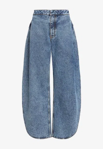 Alaïa Petal-leg Washed Jeans In Blue