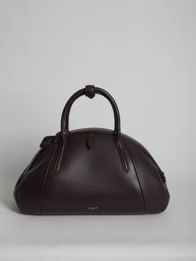 Alaïa Purse Top Handle Bag In Calfskin In Bordeaux