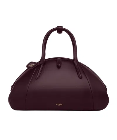 Alaïa Purse Top Handle Bag In Calfskin In Burgundy