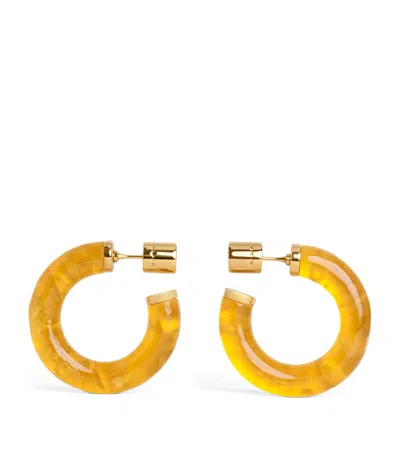 Alaïa Ray Hoop Earrings In Yellow