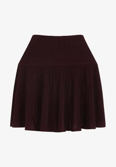 Alaïa Rib-knit Flared Mini Skirt In Burgundy