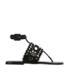 Alaïa Rivet Flat-soled Sandals In Black