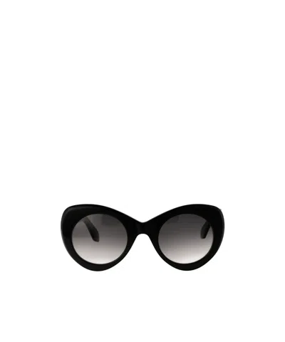 Alaïa Round-frame Sunglasses In Black