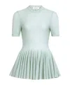 Alaïa Virgin Wool Peplum Top In Blue