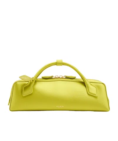 Alaïa Satin Clutch In Yellow