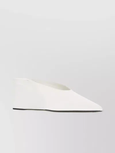 ALAÏA SATIN MULES WITH POINTED TOE AND WEDGE HEEL