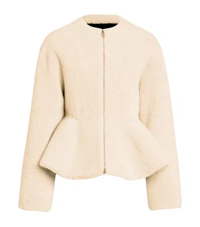 Alaïa Shearling Peplum Jacket In Neutral