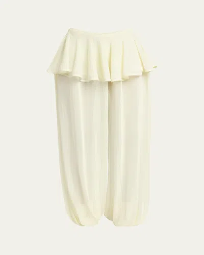 Alaïa Sheer Peplum Pants In Neutral