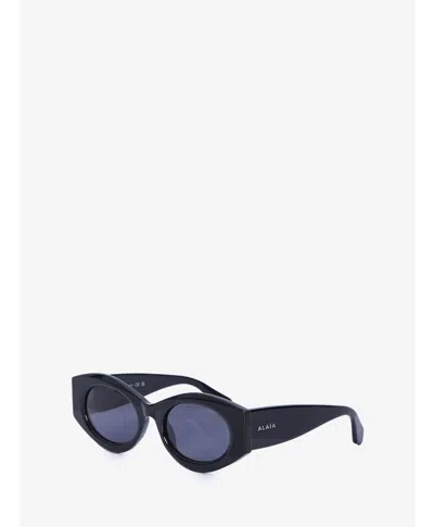 Alaïa Oval Sunglasses In Black