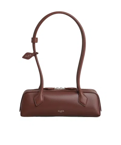 Alaïa Le Teckel Small Leather Shoulder Bag In Brown
