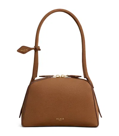 Alaïa Small Leather Le Bouledogue Shoulder Bag In Brown