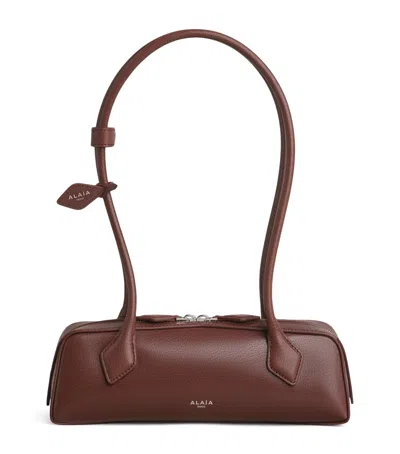 Alaïa Small Leather Le Teckel Shoulder Bag In Brown