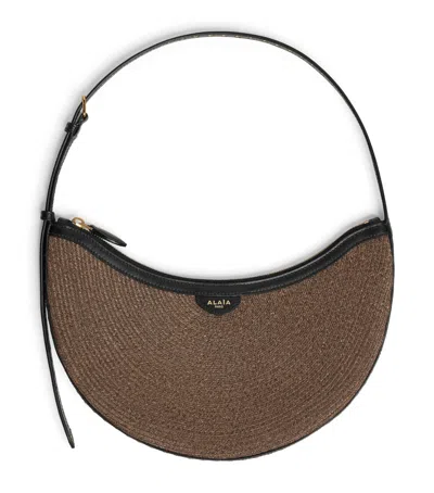 Alaïa Small One Piece Demi Lune Shoulder Bag In Brown