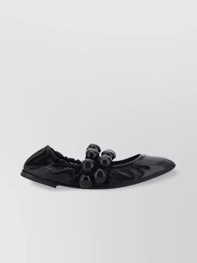 ALAÏA SPHERICAL BEADED BALLET FLATS