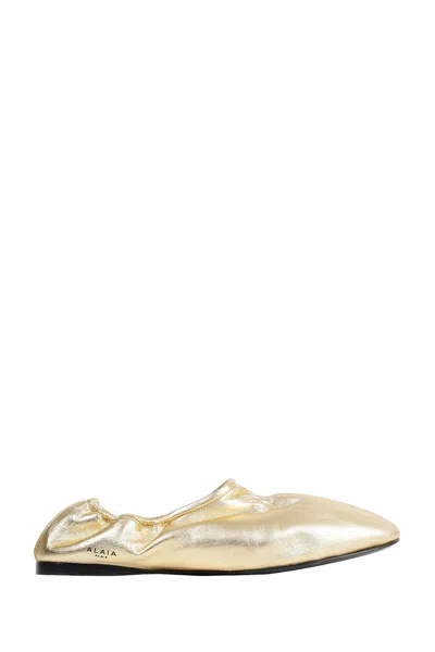 Alaïa Supple Leather Slippers In Gold