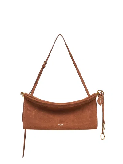 Alaïa Terre D'ombre "le Click East West" Shoulder Bag In Brown