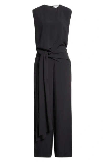 Alaïa Tie Front Open Back Jersey Jumpsuit In Black
